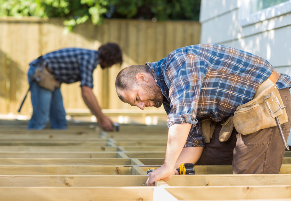 Two Handyman working on a wooden deck